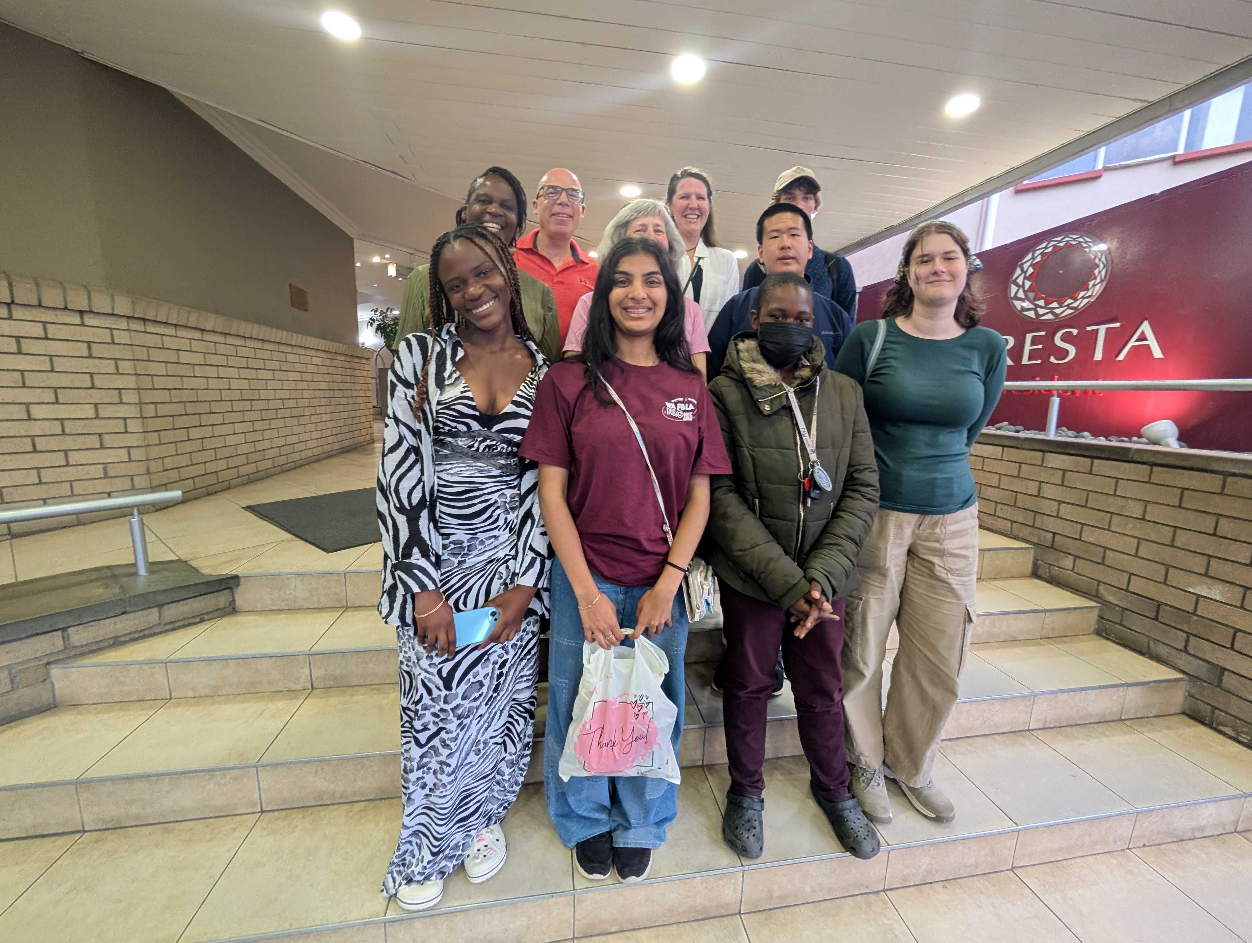 Group photo of us, Gaone, and her son and daughter in front of the tea shop