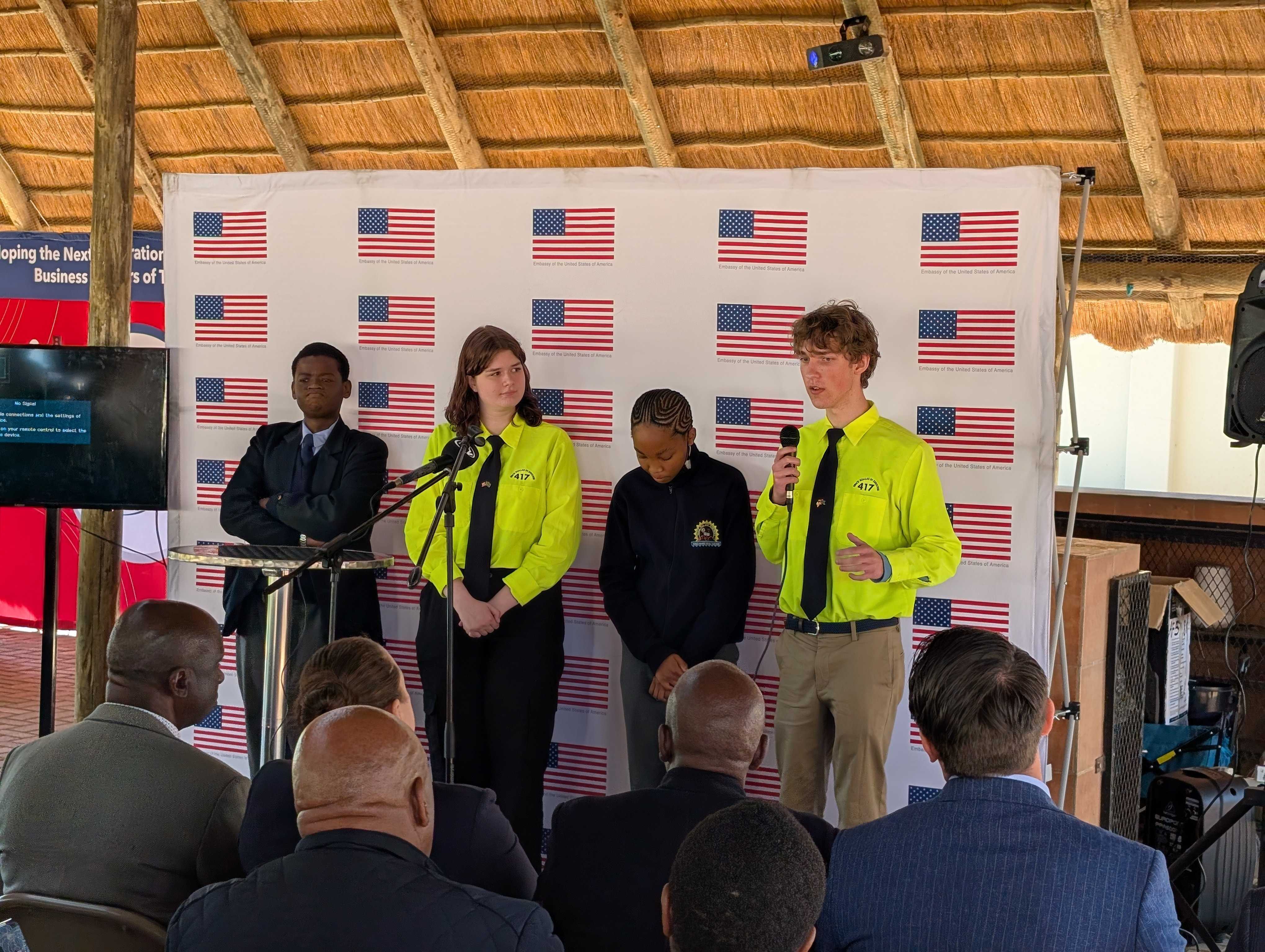 Eric making a speech; from left to right: Kgyle, Emlyn, Lesire, and Eric